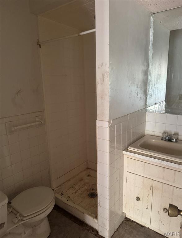 340 S Kitchen St, Dexter, MO 63841 - full bath with a stall shower, vanity, and tile walls