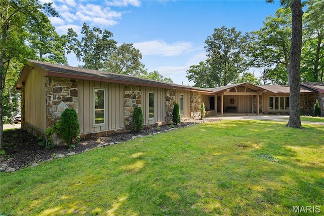 2402 Ripley Rte Unit A, Doniphan, MO 63935 - view of front of property featuring stone siding, board and batten siding, and a front yard
