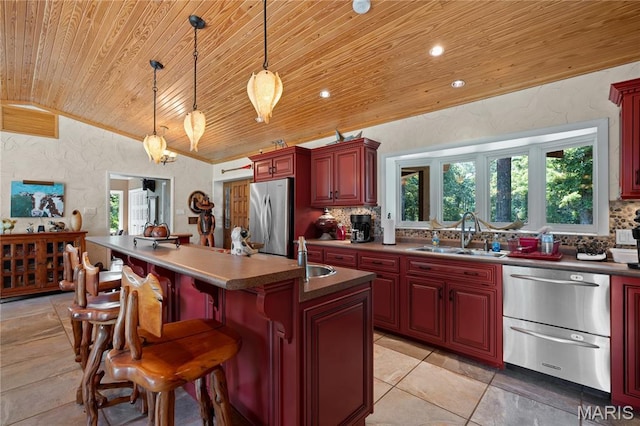 2402 Ripley Rte Unit A, Doniphan, MO 63935 - kitchen with wood ceiling, vaulted ceiling, stainless steel appliances, dark brown cabinets, and backsplash
