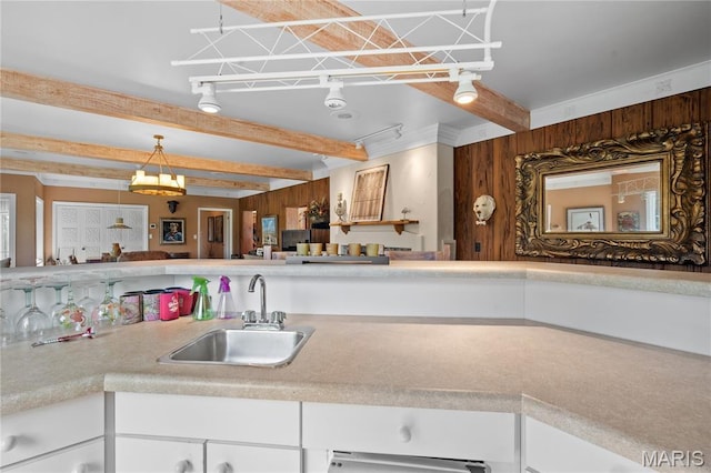 2402 Ripley Rte Unit A, Doniphan, MO 63935 - kitchen featuring white cabinets, light countertops, beam ceiling, and decorative light fixtures