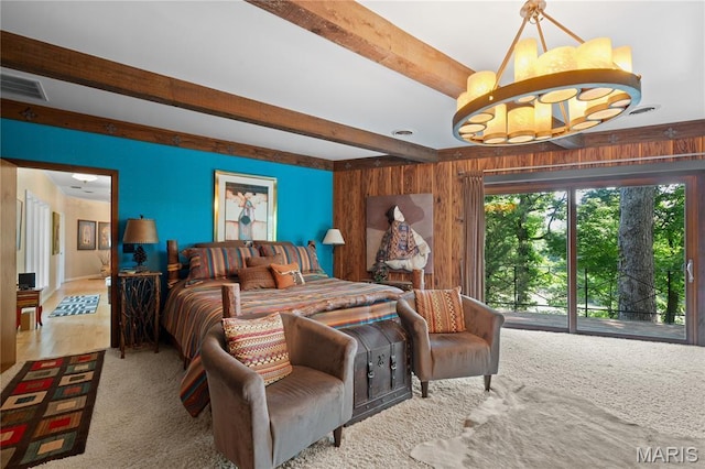 2402 Ripley Rte Unit A, Doniphan, MO 63935 - carpeted bedroom with beam ceiling, wood walls, access to exterior, and a chandelier