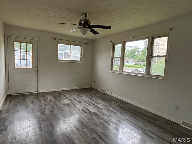 348 Mill St, Bethalto, IL 62010 - empty room featuring wood finished floors, a ceiling fan, and a textured ceiling