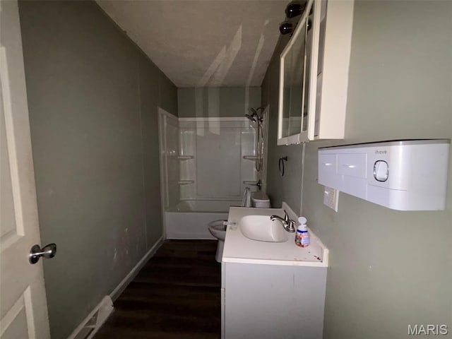 348 Mill St, Bethalto, IL 62010 - bathroom featuring wood finished floors, vanity, and bathtub / shower combination