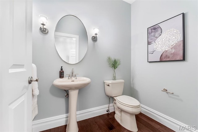 110 N Newstead Ave Unit 303, Saint Louis, MO 63108 - bathroom with wood finished floors and toilet