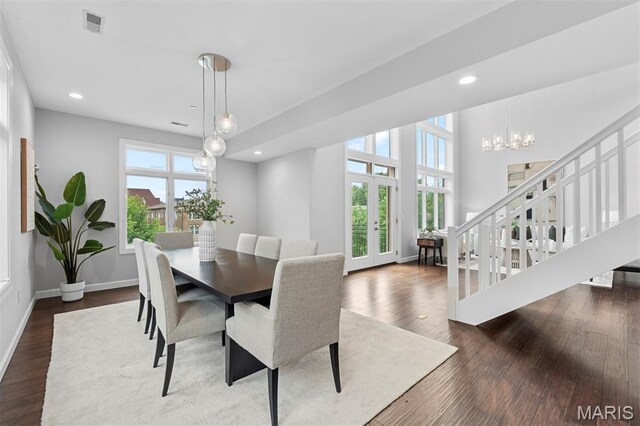 110 N Newstead Ave Unit 303, Saint Louis, MO 63108 - dining space featuring a chandelier, french doors, dark wood finished floors, stairs, and recessed lighting
