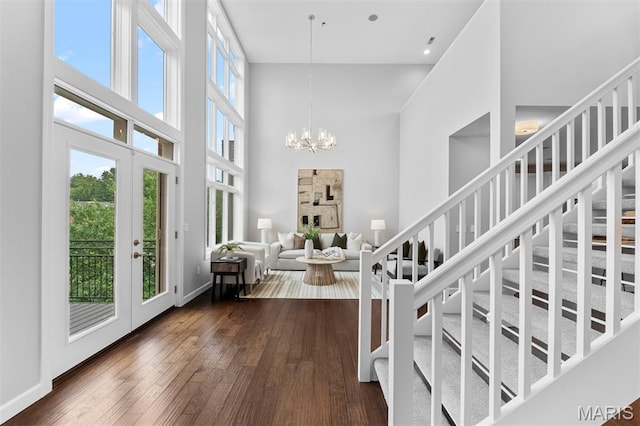 110 N Newstead Ave Unit 303, Saint Louis, MO 63108 - entryway with a high ceiling, dark wood-style floors, and a chandelier