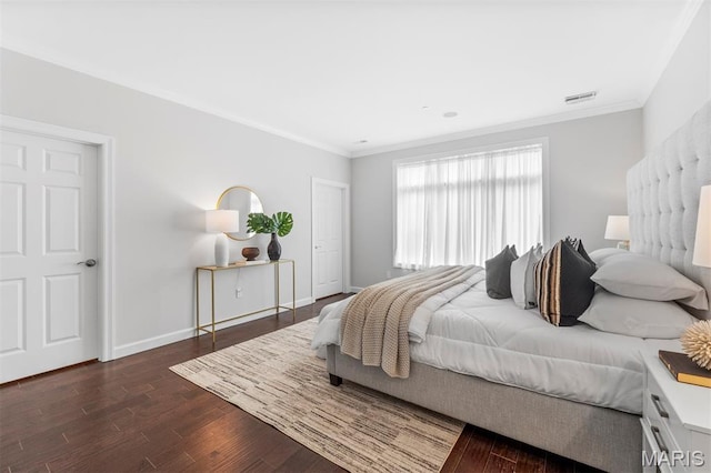 110 N Newstead Ave Unit 303, Saint Louis, MO 63108 - bedroom with dark wood finished floors and ornamental molding