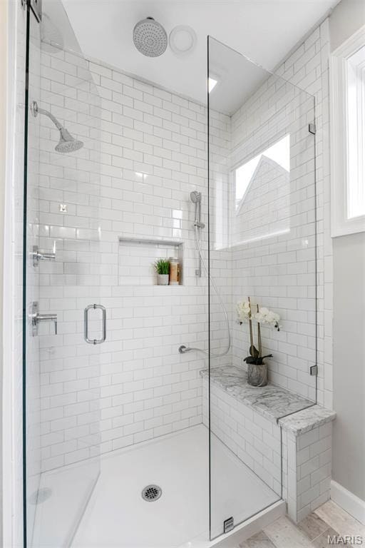 110 N Newstead Ave Unit 303, Saint Louis, MO 63108 - full bathroom with a stall shower and baseboards