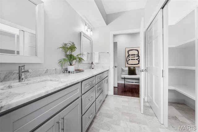 110 N Newstead Ave Unit 303, Saint Louis, MO 63108 - full bathroom featuring double vanity and baseboards