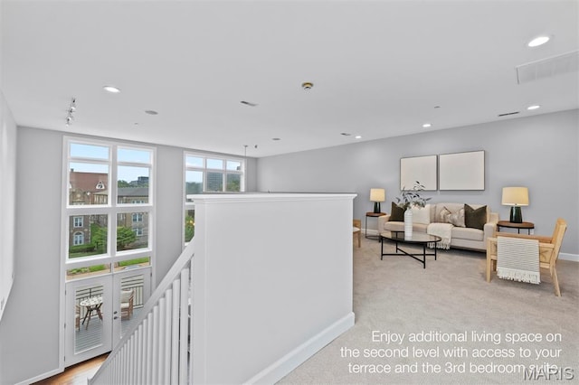 110 N Newstead Ave Unit 303, Saint Louis, MO 63108 - hall featuring an upstairs landing, recessed lighting, and light colored carpet