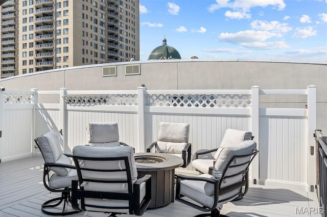 110 N Newstead Ave Unit 303, Saint Louis, MO 63108 - wooden terrace with a fire pit