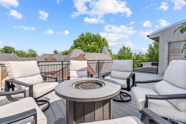 110 N Newstead Ave Unit 303, Saint Louis, MO 63108 - wooden deck with an outdoor living space with a fire pit