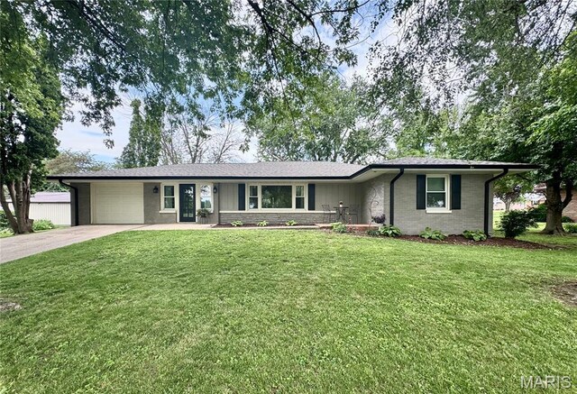 1311 W Line St, Palmyra, MO 63461 - ranch-style house featuring an attached garage, driveway, a front yard, and brick siding
