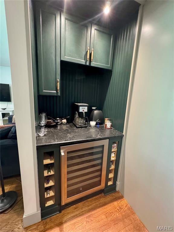 1311 W Line St, Palmyra, MO 63461 - indoor dry bar with wine cooler and light wood-style flooring