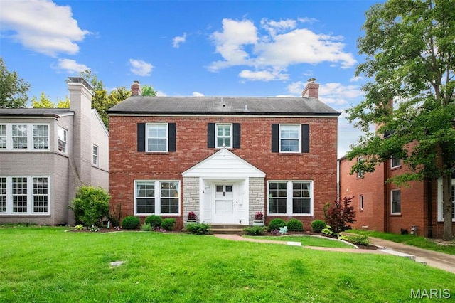 8140 Pershing Ave, Clayton, MO 63105 - view of front of house with a chimney, a front lawn, and brick siding