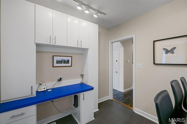 8140 Pershing Ave, Clayton, MO 63105 - office area with rail lighting and dark tile patterned floors