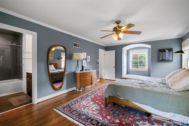 8140 Pershing Ave, Clayton, MO 63105 - bedroom with wood finished floors, crown molding, arched walkways, and a ceiling fan