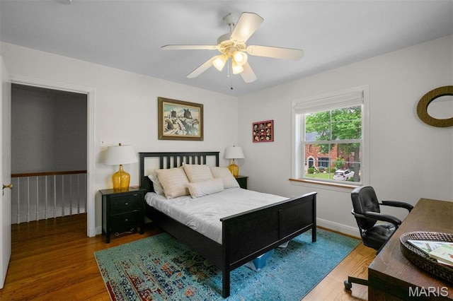 8140 Pershing Ave, Clayton, MO 63105 - bedroom with wood finished floors, an office area, and ceiling fan