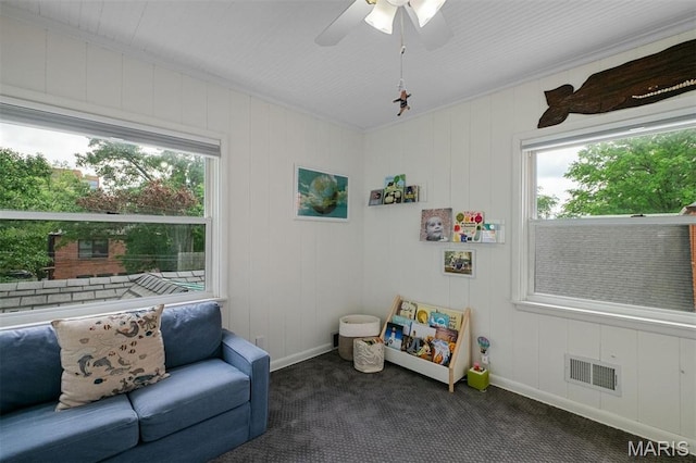 8140 Pershing Ave, Clayton, MO 63105 - sitting room featuring dark carpet, ceiling fan, and ornamental molding