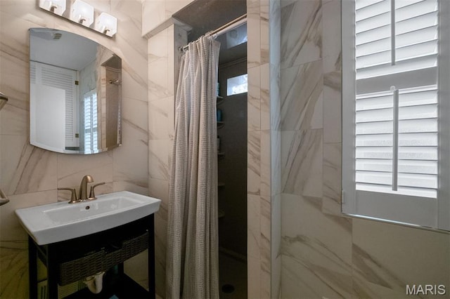 8140 Pershing Ave, Clayton, MO 63105 - full bath with a shower stall, tile walls, and vanity