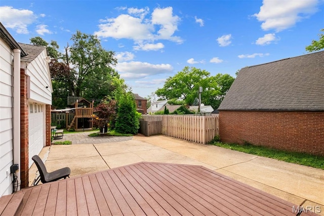 8140 Pershing Ave, Clayton, MO 63105 - wooden deck with a patio and a garage