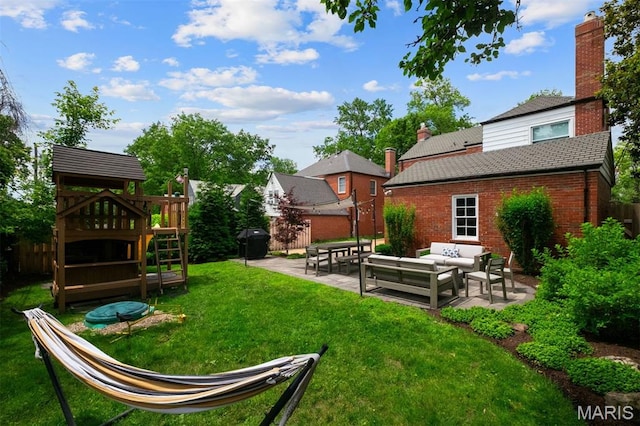 8140 Pershing Ave, Clayton, MO 63105 - view of yard with outdoor lounge area, a patio area, and a playground