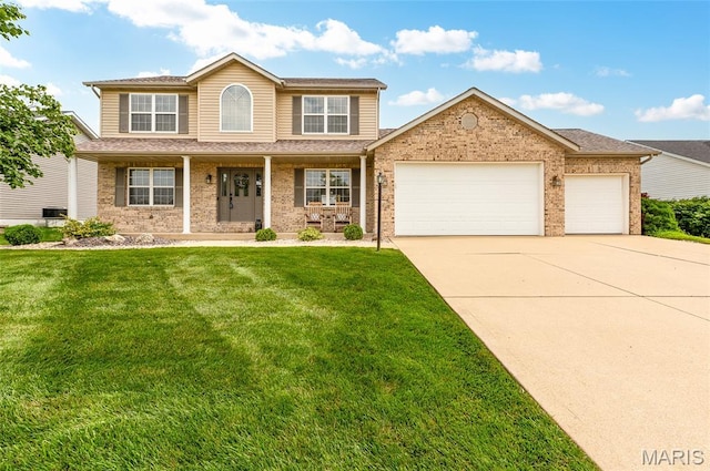 201 Mcclelland Dr, Troy, IL 62294 - view of front facade featuring driveway, an attached garage, a front yard, and brick siding