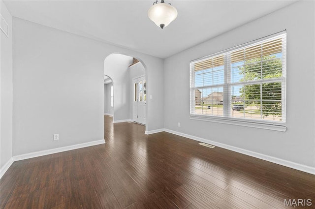 201 Mcclelland Dr, Troy, IL 62294 - empty room with arched walkways and wood finished floors