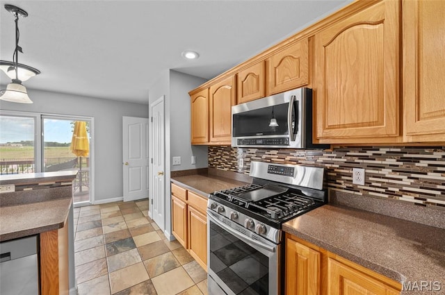 201 Mcclelland Dr, Troy, IL 62294 - kitchen with stainless steel appliances, dark countertops, tasteful backsplash, recessed lighting, and light stone finish flooring
