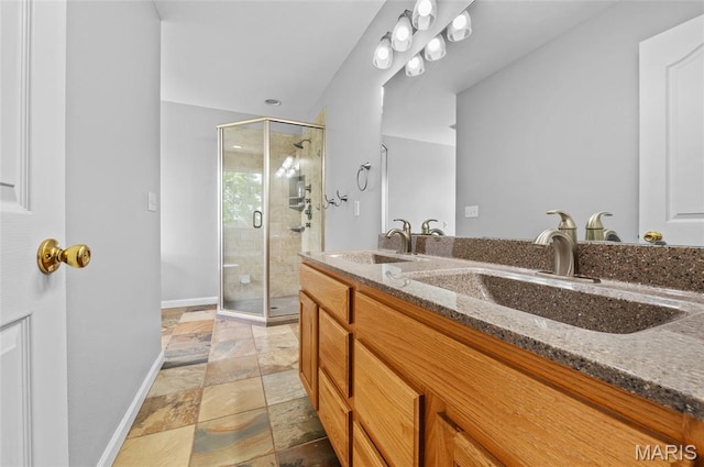 201 Mcclelland Dr, Troy, IL 62294 - full bath with double vanity, a shower stall, and stone tile floors