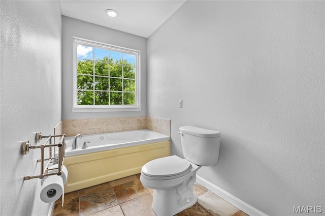 201 Mcclelland Dr, Troy, IL 62294 - full bathroom with a garden tub and stone finish floors