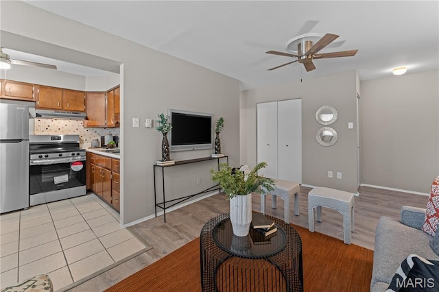 9003 Villaridge Ct Unit A, Affton, MO 63123 - living room featuring a ceiling fan and light wood-type flooring