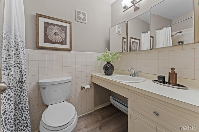 9003 Villaridge Ct Unit A, Affton, MO 63123 - bathroom with tile walls, vanity, wood finished floors, a shower with shower curtain, and wainscoting