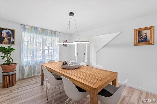 1549 Cascade Ln, Eureka, MO 63025 - dining area with light wood-style floors and baseboards