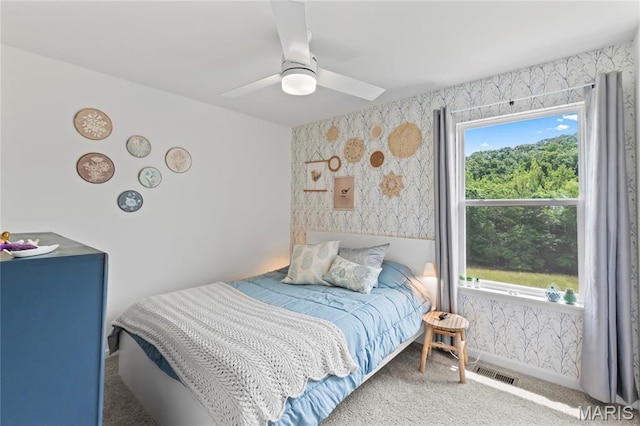 1549 Cascade Ln, Eureka, MO 63025 - carpeted bedroom with wallpapered walls and a ceiling fan