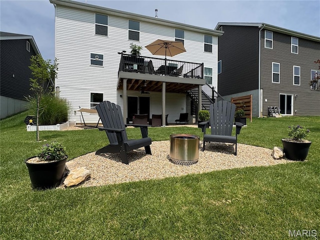 1549 Cascade Ln, Eureka, MO 63025 - back of property featuring stairway, a deck, an outdoor fire pit, and a yard