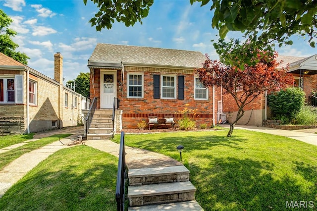 7041 Plainview Ave, Saint Louis, MO 63109 - view of front of home featuring brick siding, a front lawn, and roof with shingles