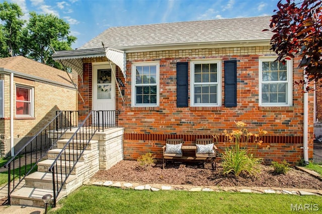 7041 Plainview Ave, Saint Louis, MO 63109 - view of front facade featuring brick siding and roof with shingles
