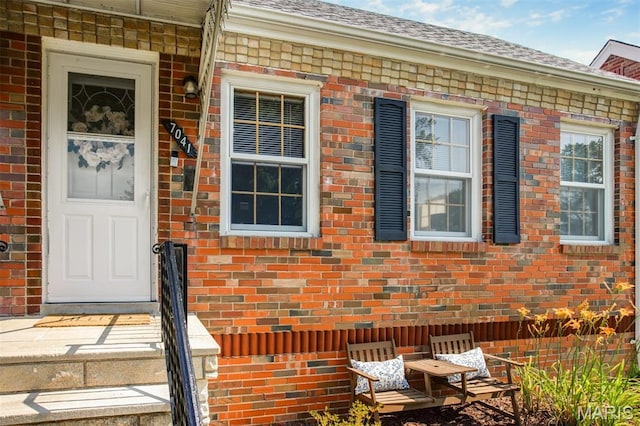 7041 Plainview Ave, Saint Louis, MO 63109 - property entrance with brick siding and a shingled roof