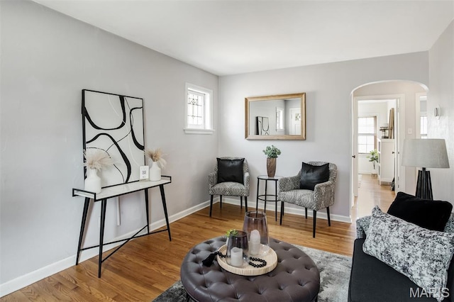 7041 Plainview Ave, Saint Louis, MO 63109 - sitting room with arched walkways and wood finished floors