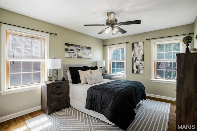 7041 Plainview Ave, Saint Louis, MO 63109 - bedroom with wood finished floors, multiple windows, and ceiling fan