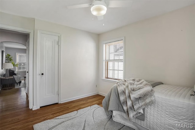 7041 Plainview Ave, Saint Louis, MO 63109 - bedroom with arched walkways, wood finished floors, and ceiling fan