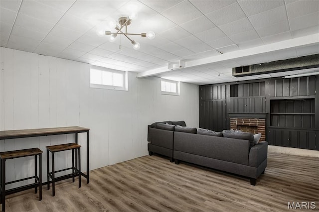 7041 Plainview Ave, Saint Louis, MO 63109 - living area featuring wood finished floors and a fireplace
