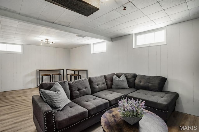 7041 Plainview Ave, Saint Louis, MO 63109 - living room with healthy amount of natural light, wood finished floors, and wooden walls