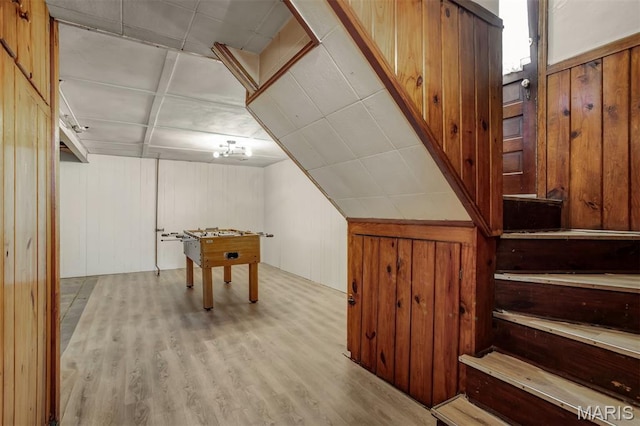 7041 Plainview Ave, Saint Louis, MO 63109 - recreation room with wooden walls and wood finished floors