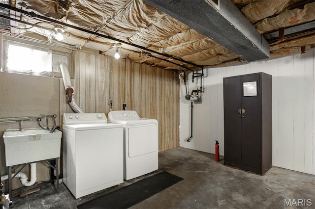 7041 Plainview Ave, Saint Louis, MO 63109 - laundry area with washer and clothes dryer and wooden walls
