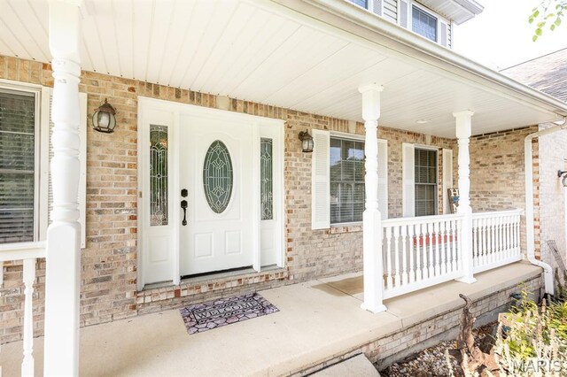 1241 Antique Ln, Mascoutah, IL 62258 - doorway to property with covered porch and brick siding