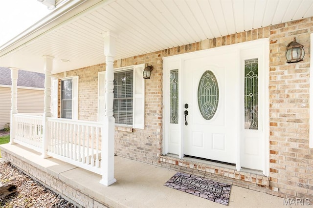 1241 Antique Ln, Mascoutah, IL 62258 - view of exterior entry featuring a porch and brick siding