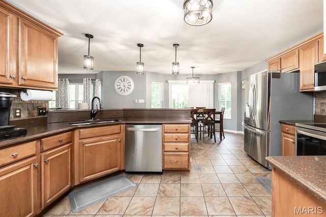 1241 Antique Ln, Mascoutah, IL 62258 - kitchen featuring stainless steel appliances, tasteful backsplash, and hanging light fixtures