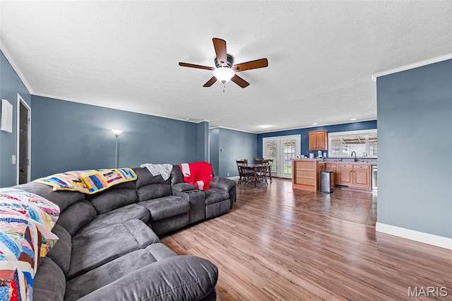 44 Viola Dr, Wright City, MO 63390 - living area featuring a ceiling fan, wood finished floors, and a textured ceiling